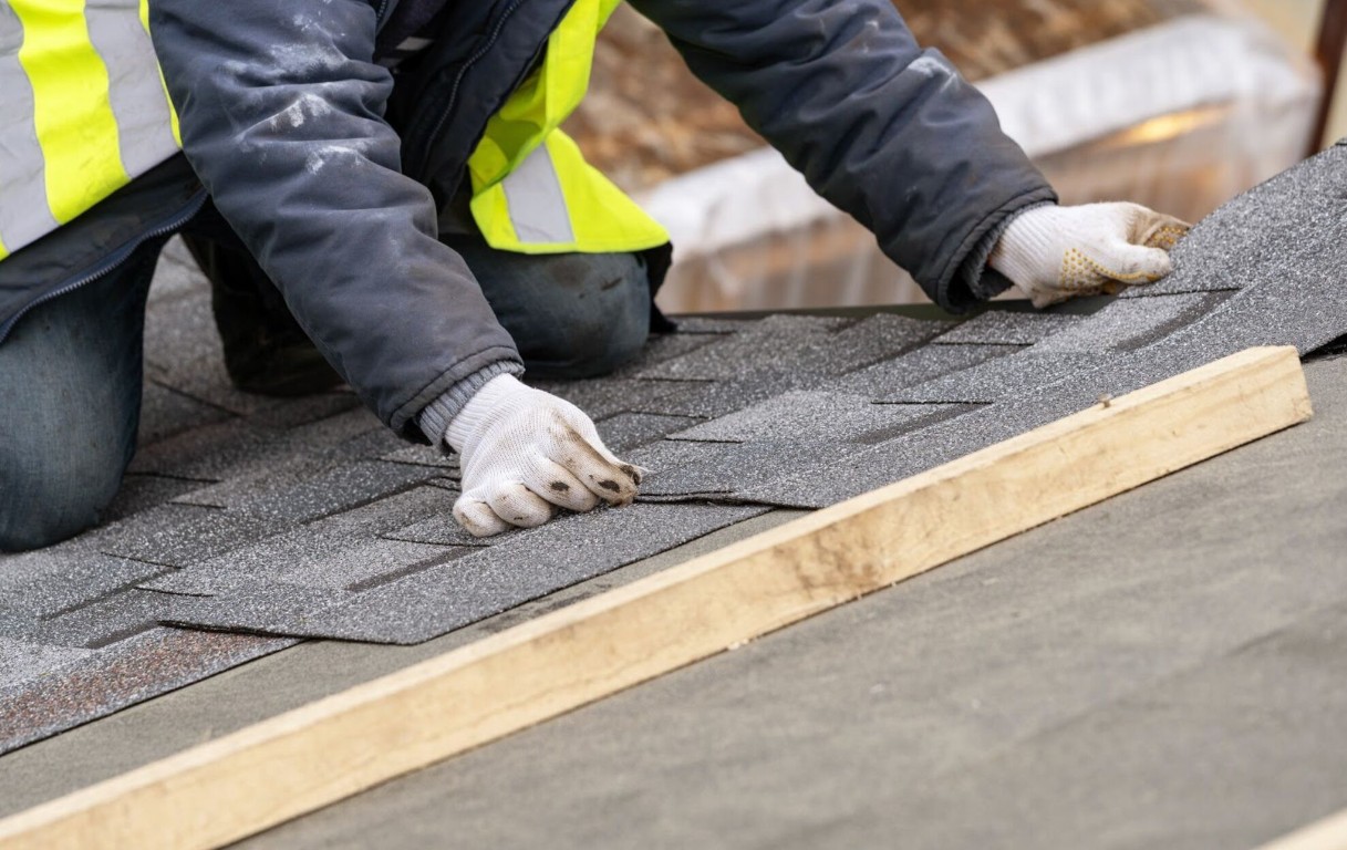 Expert roof repair technician installing quality shingles in Lake Forest, CA